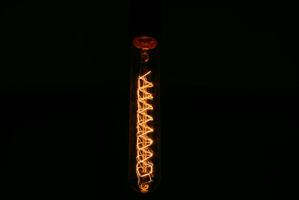 A picture of a DNA model lighting up inside a plastic lab tube.