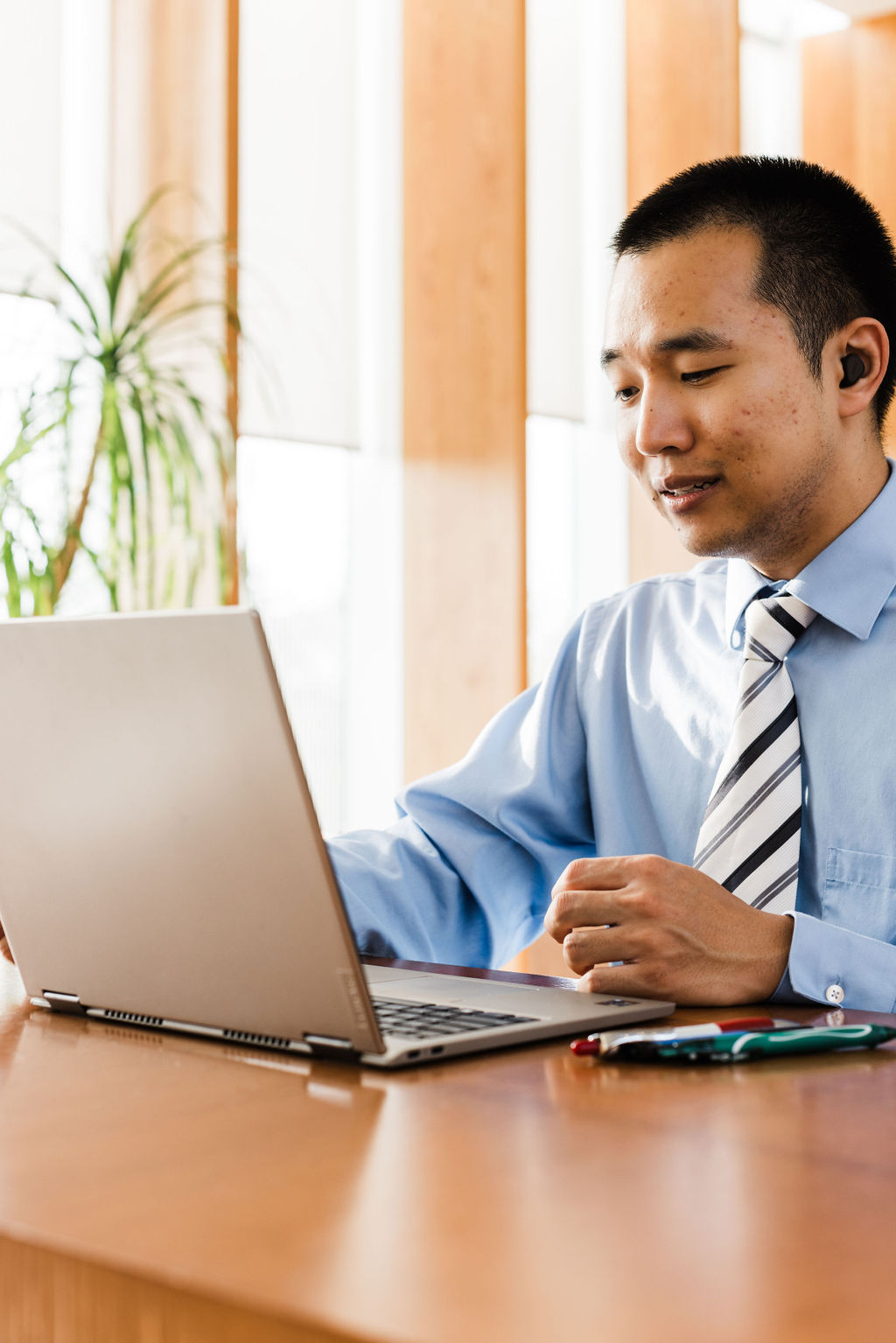 Paul talking to a client on a laptop