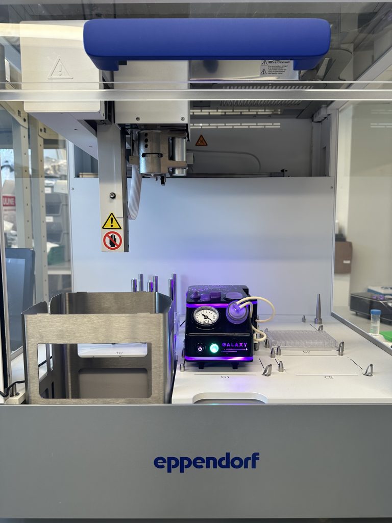 A photograph of the Portal Galaxy inside an Eppendorf automated liquid handler, highlighting their partnership