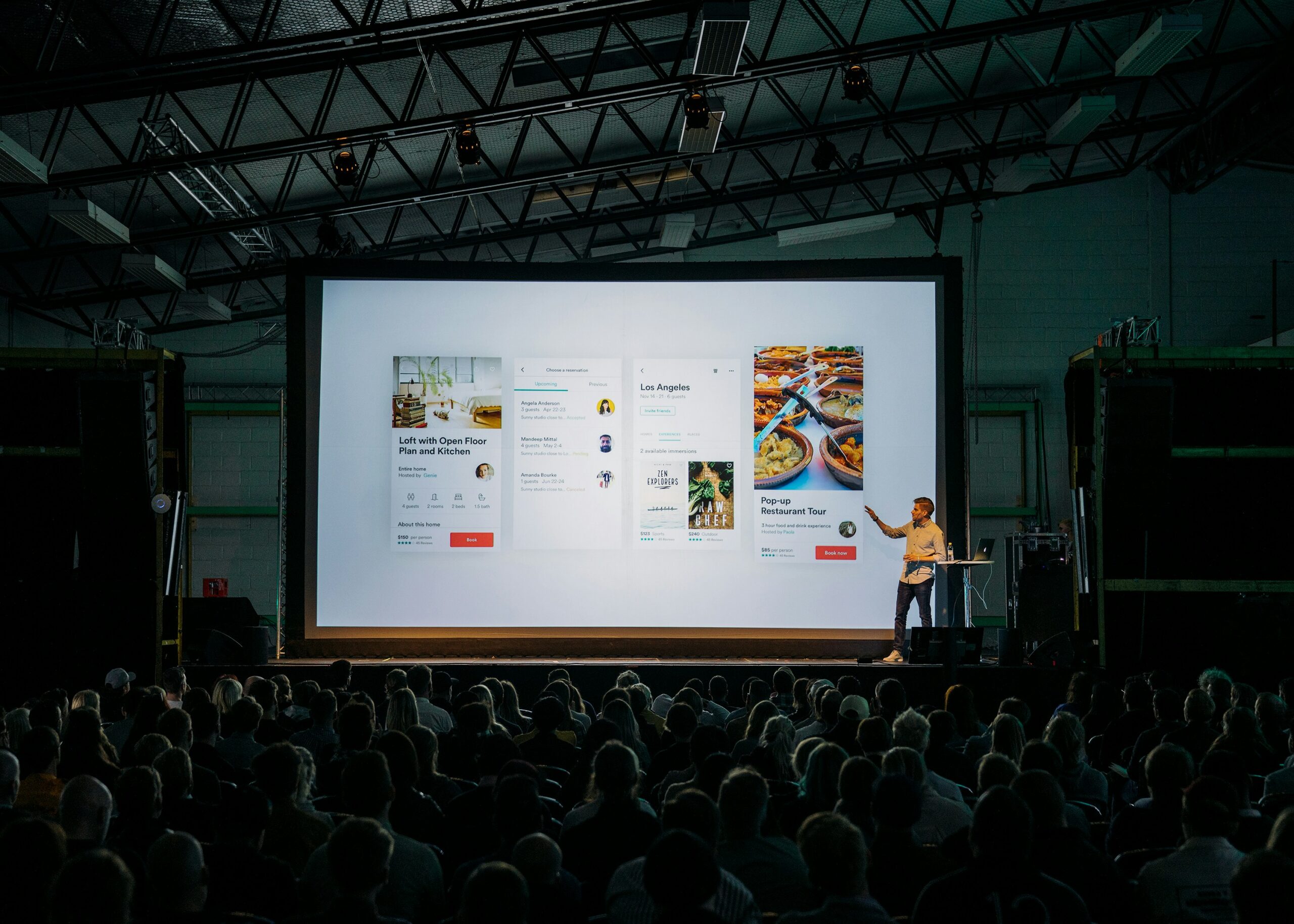 A person giving a presentation about his product to an audience
