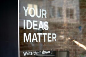 A window with the words "Your Ideas Matter" on it