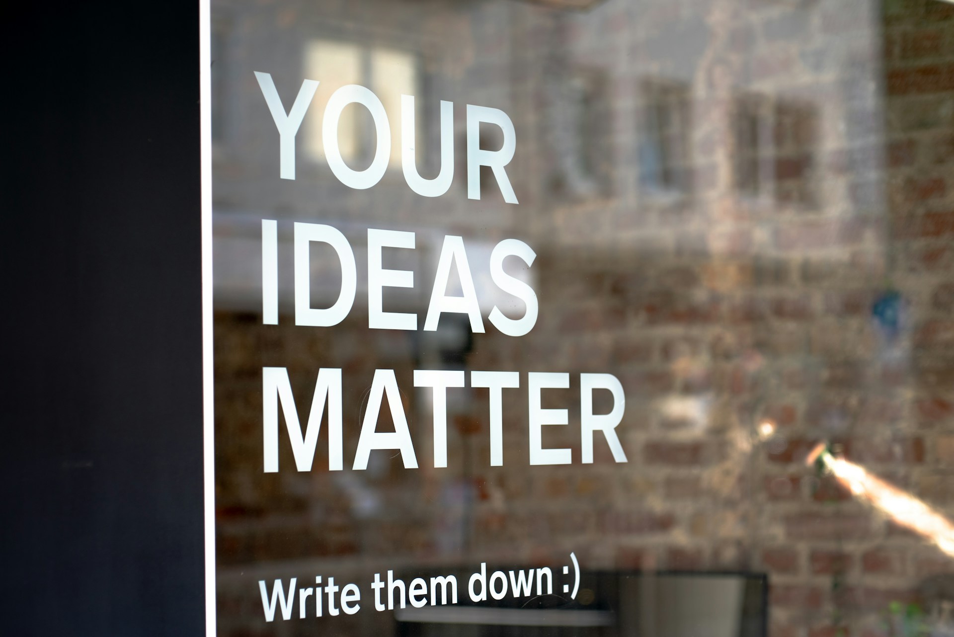 A window with the words "Your Ideas Matter" on it